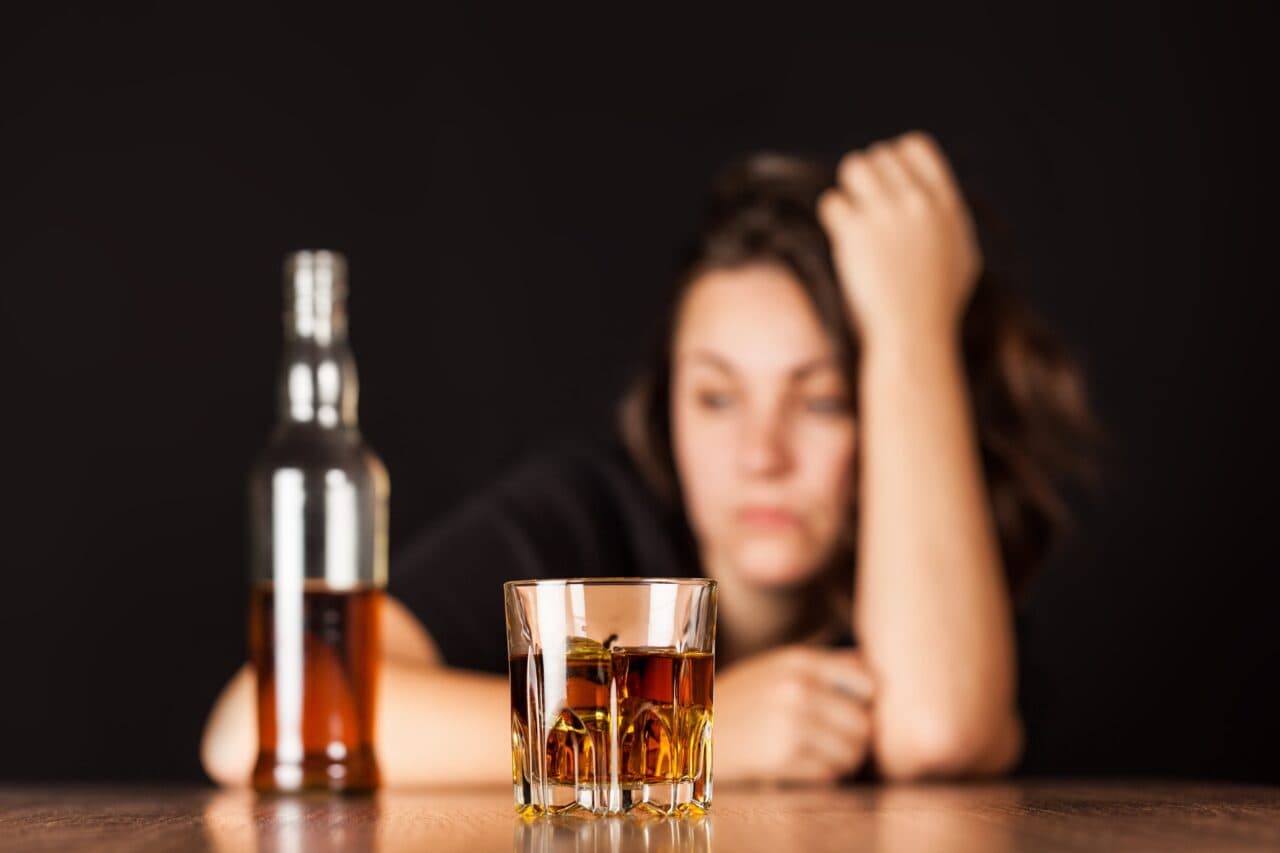 a woman showing signs of alcoholism