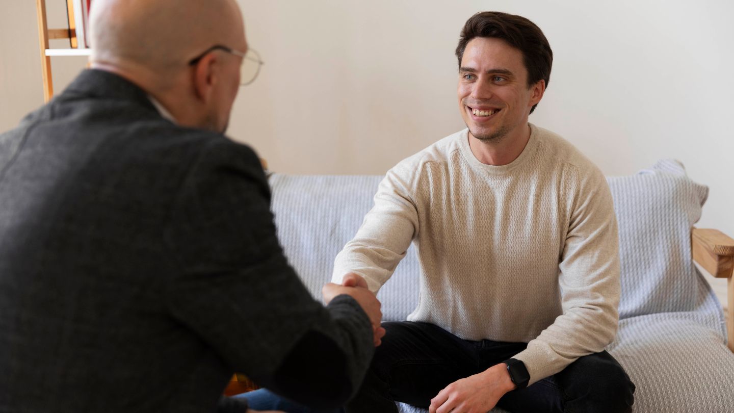 A man greeting his therapist during an individual session at rehab near Lake Jackson, TX.