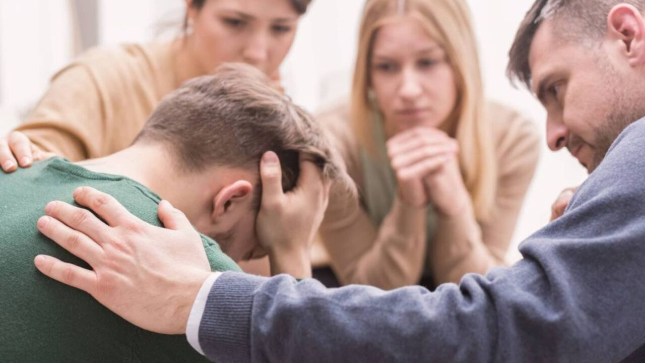 A young man struggling with substance addiction receives support from his family.