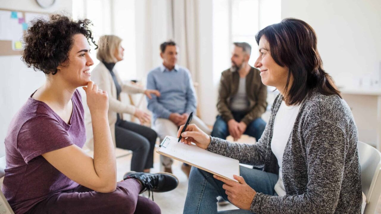 A professional conducting an assessment during dual diagnosis treatment in Austin, TX.