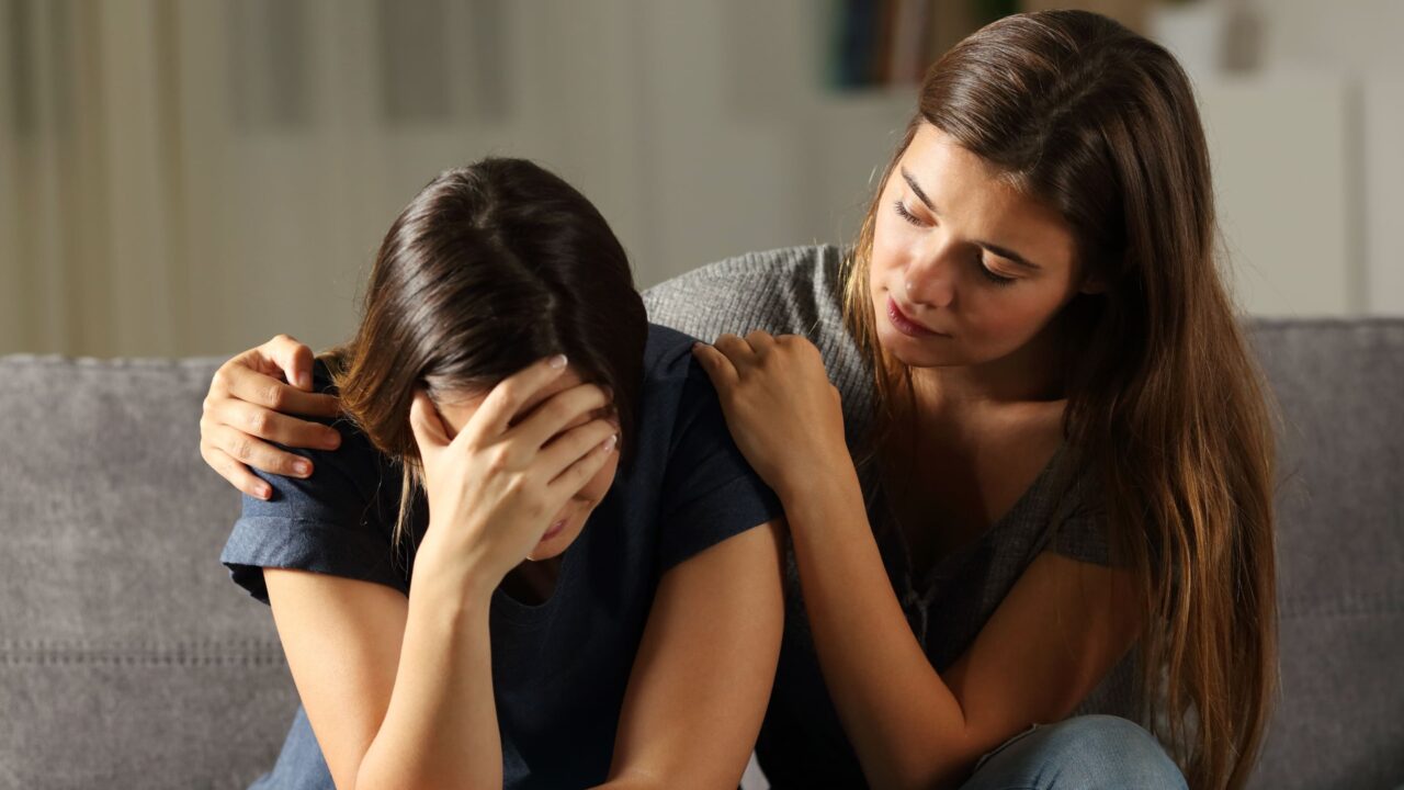 A woman encourages her friend to start heroin addiction treatment in Austin.