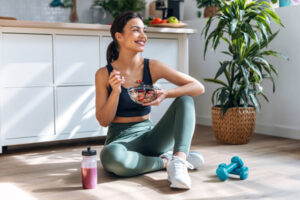 a-woman-eating-healthy-in-workout-attire