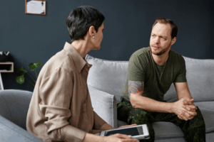 man in therapy speaking with his counselor about benzos