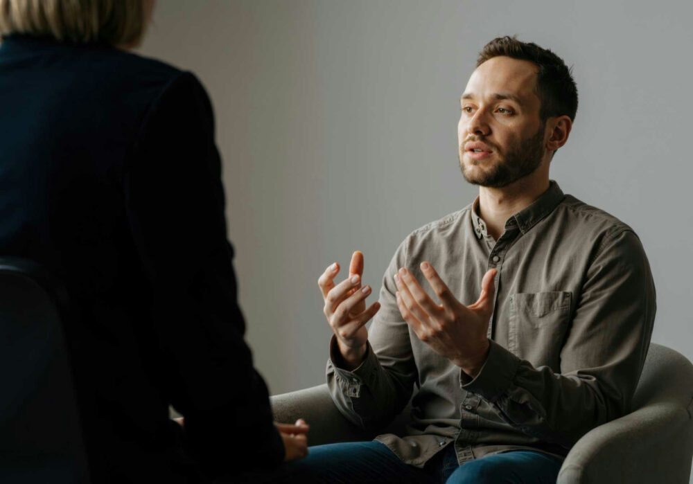 a man speaking in individual therapy
